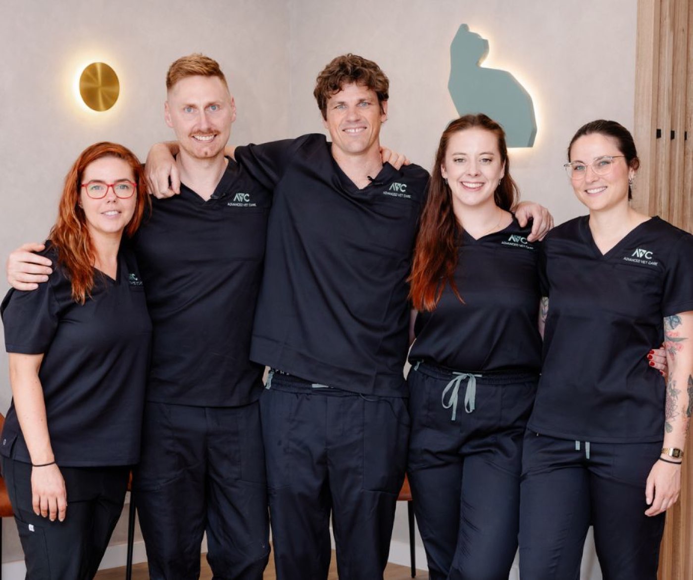 The Advanced Vet Care Lane Cove team together in the reception area